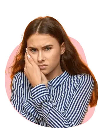 Woman with aching gums holding her face