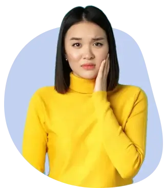 Woman touching her cheek from a painful canker sore