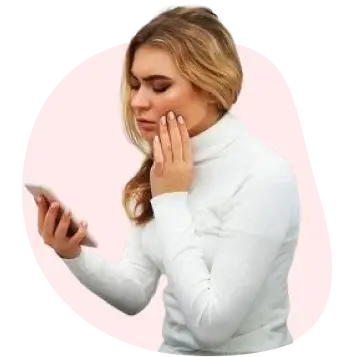 Woman holding her jaw after chipping a tooth