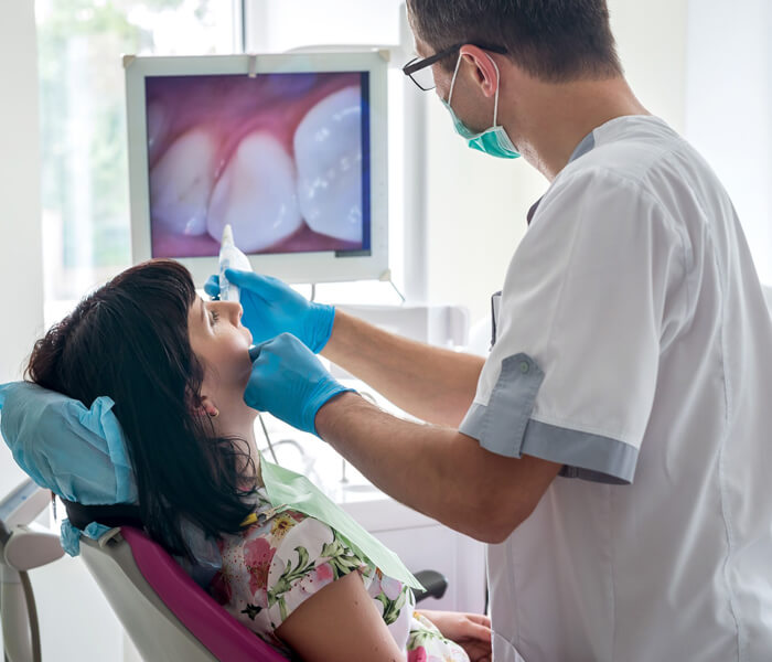 Dentist examining a patient's teeth