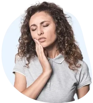 Woman holding her cheek with a severe toothache